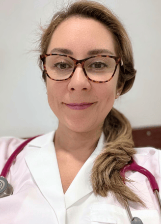 a woman in a white lab coat and glasses