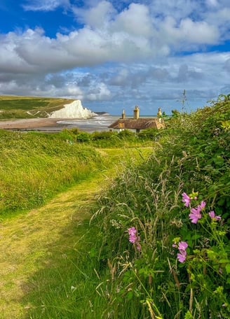 image of the famous Fishermans cottages with the cliffs of the Seven Sisters. 