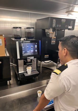 Technician calibrating Schaerer espresso machine on a cruise ship in South Florida