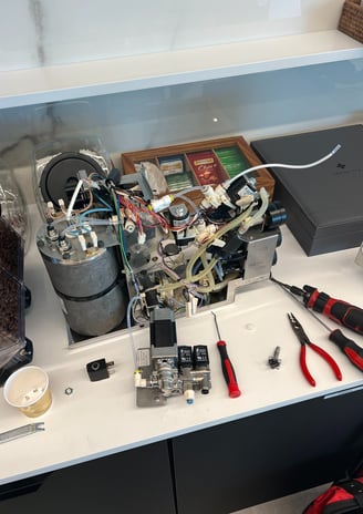 coffee-machine-opened-for-repair-and-troubleshooting.jpg