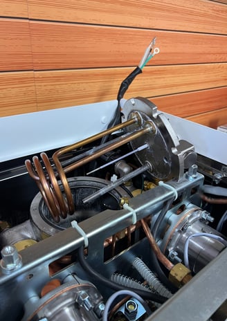 Internal boiler heating element exposed on La Spaziale espresso machine during repair