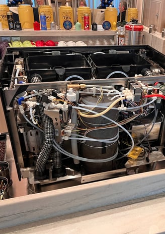 Steam boiler being replaced during repair of espresso machine in South Florida