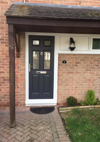 grey composite front door with silver hardware fitted in Stubbington by Buildmydoor
