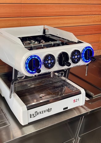 La Spaziale S21 espresso machine set up with grinder and tools ready for calibration