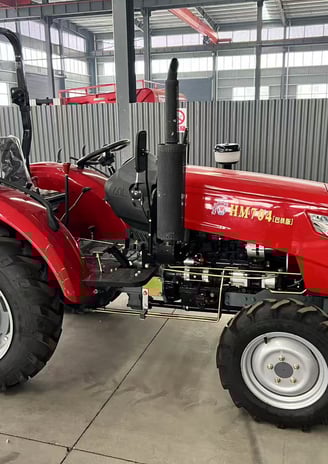 a red tractor with a large wheel on it