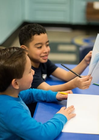 Students discuss their workbook reflections.