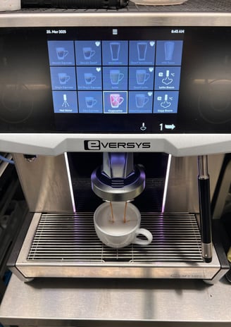 Eversys Cameo espresso machine brewing a fresh latte in a South Florida location