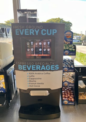 De Jong Duke self-serve coffee machine displaying espresso and specialty beverage options