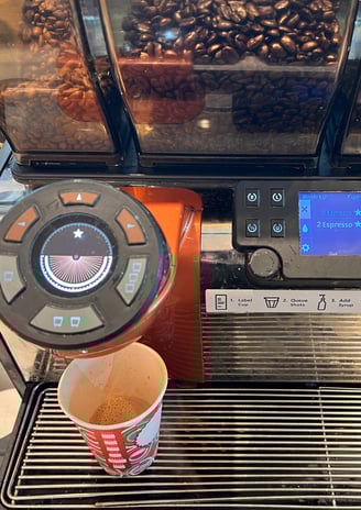 Mastrena espresso machine with double shot selected and brewing in progress