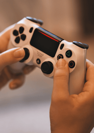 a person holding a game controller in their hands