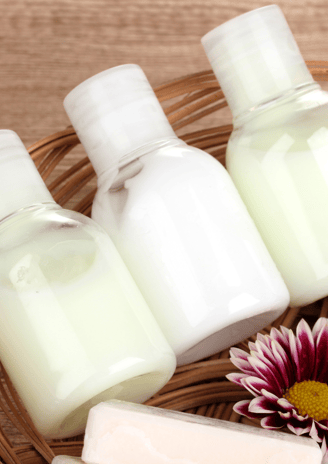 a basket of soap and soap with a flower