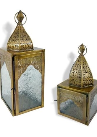 a pair of brass - plated lanterns with a glass door