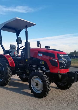 a red tractor with a canopy over it