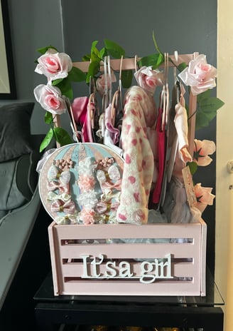 a wooden crate with a pink flower arrangement