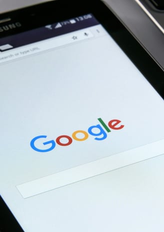 image of a tablet showing google search bar