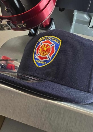 Custom embroidered firefighter hat for San Antonio Fire Department – logo embroidery by Stitch & Thr