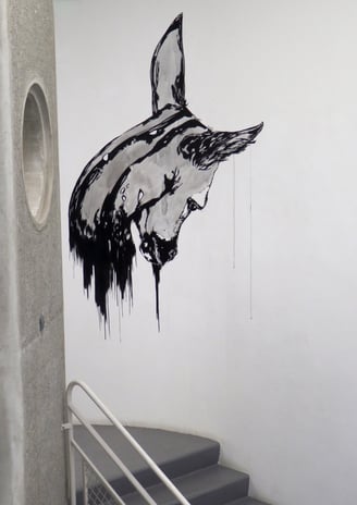 a wall mural of a horse head with a horse head