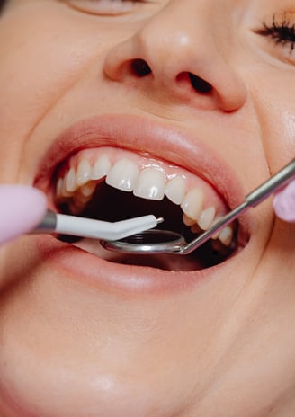 Dental surgeon performing gum surgery to treat gum disease and restore healthy gum tissue