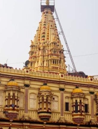 a large building with a tower with a clock on it