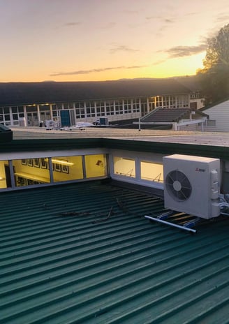 a large air conditioner sitting on top of a roof