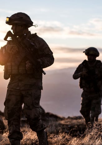 a soldier using a tactical watch strap on his tacital watch