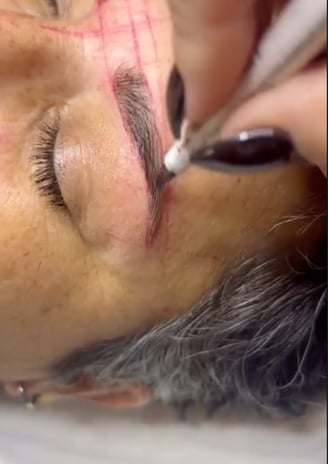 a woman with a black eyeliners and a black eyeliners