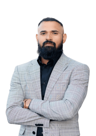 Albin Rappai in a grey suite and dark beard.