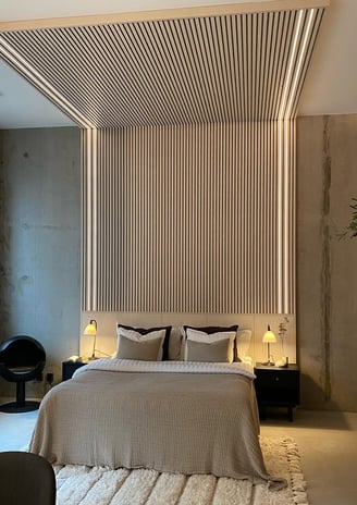 a bedroom with a bed and a chair