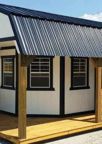 a small cabin with a porch and a porch with a porch