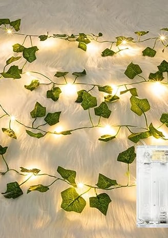 a white light bulb string lights up in a room