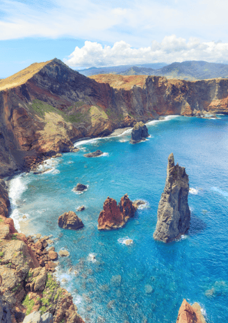 a view of a rocky coastline with a view of the ocean