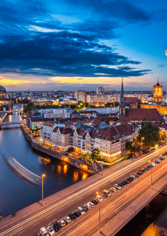 a cityscape of a river with a bridge and a tower