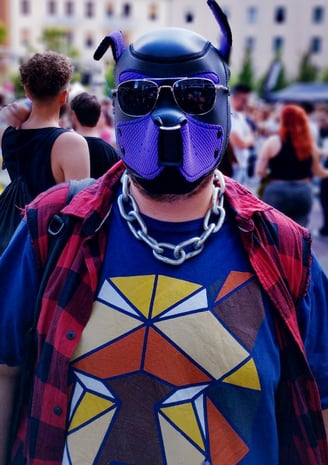 Man in pup mask on a busy street.