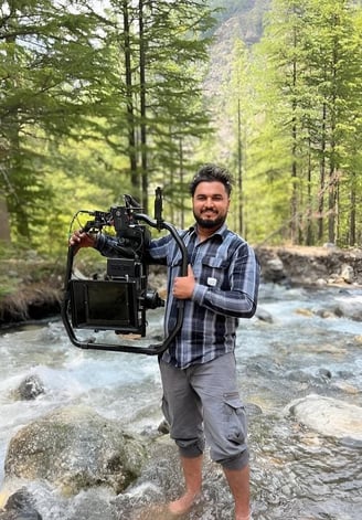 sukhvinder singh standing in a stream of water