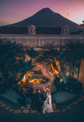antigua guatemala wedding photograpaher- couple dancing with volcano in background