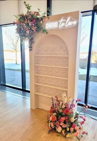 Champagne wall arch with sping flowers, champagne couples and spring flowers 