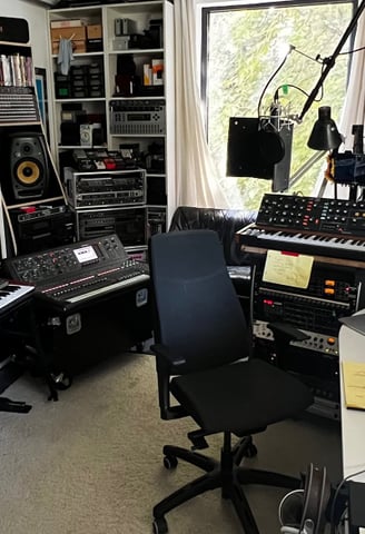 audio production suite with keyboard and synthesizers