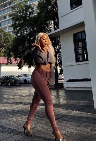 Efia Odo in a crop top and jeans trousers walking on the streets of New York City.