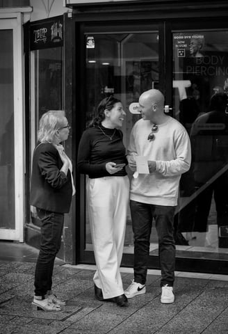 People chatting on the street captured by photographer Peter Pickering