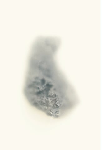 a photograph of a stone. Partly obscured by mist