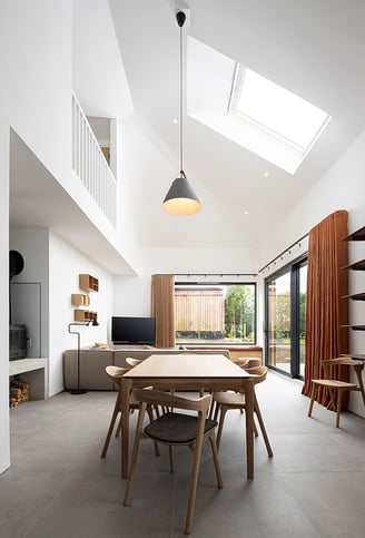a dining room with a table and chairs