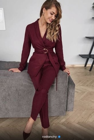 a woman in a red suit and heels