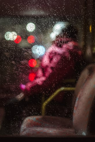 An abstract of a person seated in public transport, created by Josh K Jackson.