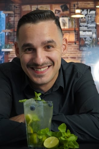 a man with a mojitte and a mojitte