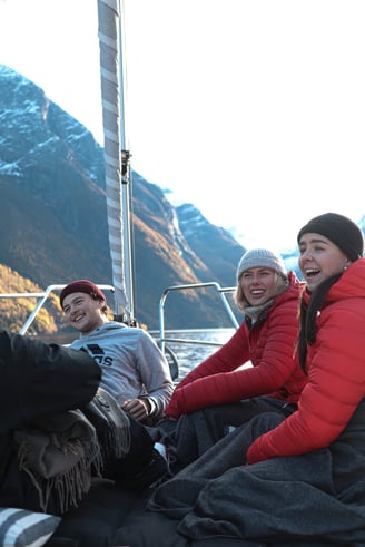 a group of people sitting on a boat