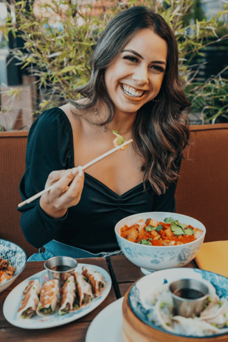a woman is eating a meal at a restaurant