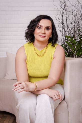 a woman sitting on a couch in a living room