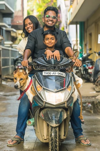 a man and two children on a scooter