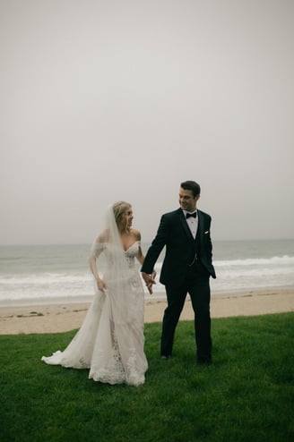 Bride and groom walking on the beach in Wells Beach Maine