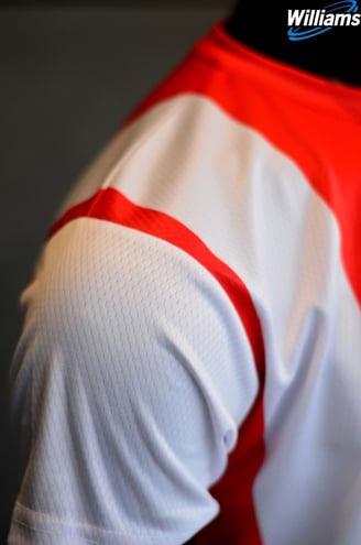 a close up of a man's shirt with a red and white shirt